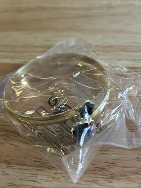 Gold Tone Bangle Bracelet with Black Flower Charms